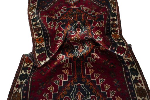 Corner detail of 2000s Shiraz rug showing border pattern and Wool pile