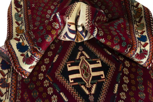 Corner detail of 2000s Shiraz rug showing border pattern and Wool pile