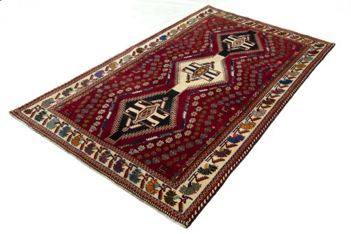 Corner detail of 2000s Shiraz rug showing border pattern and Wool pile