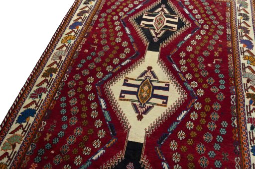 Backside of handmade 2000s Shiraz rug showing knot structure and weave density