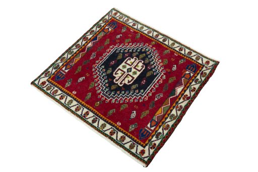 Corner detail of 2000s Shiraz rug showing border pattern and Wool pile