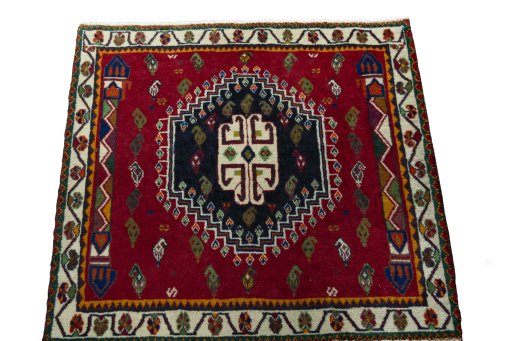 Surface texture of 2000s Shiraz rug with natural Wool and intricate pattern