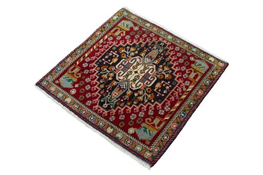 Corner detail of 2000s Shiraz rug showing border pattern and Wool pile