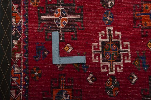 Backside of handmade 2000s Shiraz rug showing knot structure and weave density
