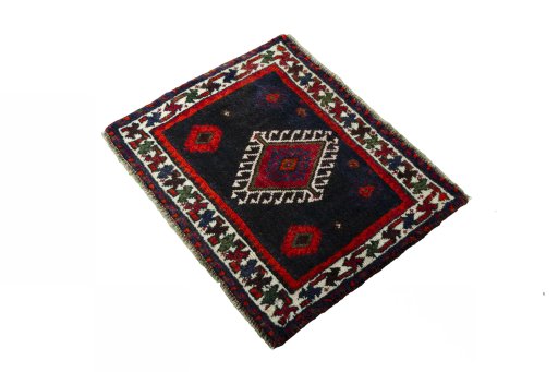 Corner detail of 2000s Shiraz rug showing border pattern and Wool pile