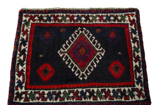 Surface texture of 2000s Shiraz rug with natural Wool and intricate pattern