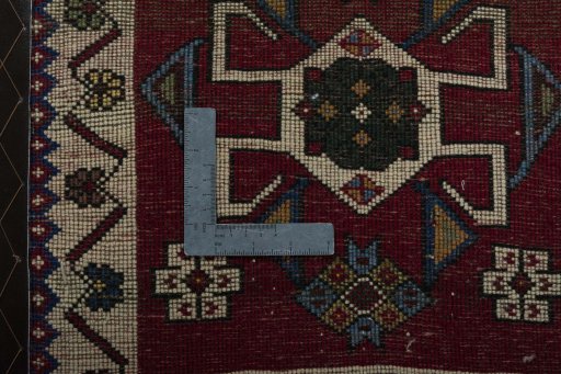 Backside of handmade 2000s Shiraz rug showing knot structure and weave density