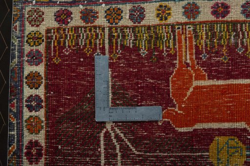 Backside of handmade 2000s Shiraz rug showing knot structure and weave density