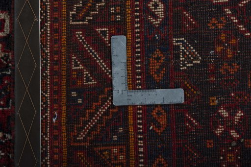 Surface texture of 2000s Shiraz rug with natural Wool and intricate pattern