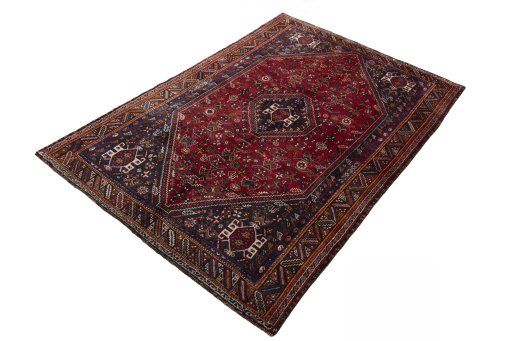 Corner detail of 2000s Shiraz rug showing border pattern and Wool pile