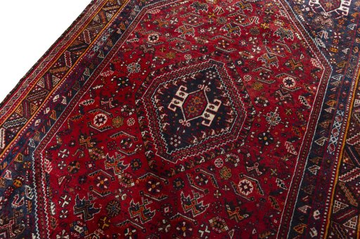 Backside of handmade 2000s Shiraz rug showing knot structure and weave density