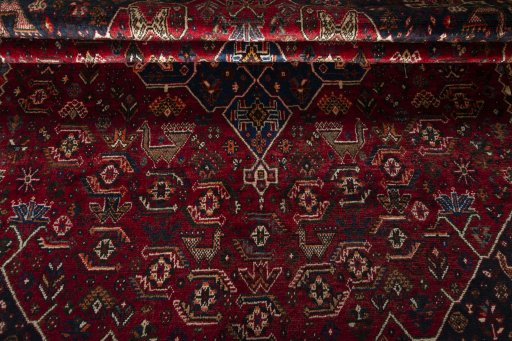 Corner detail of 1970s Shiraz rug showing border pattern and Wool pile