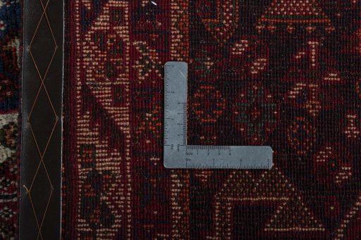 Surface texture of 1970s Shiraz rug with natural Wool and intricate pattern