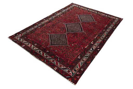 Corner detail of 2000s Shiraz rug showing border pattern and Wool pile