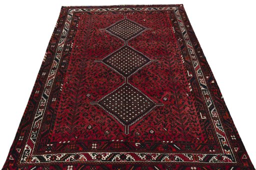 Surface texture of 2000s Shiraz rug with natural Wool and intricate pattern