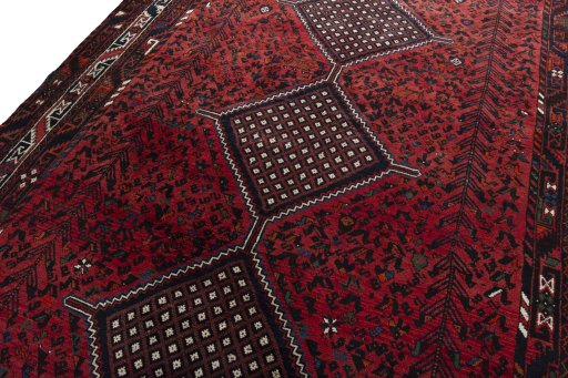 Backside of handmade 2000s Shiraz rug showing knot structure and weave density
