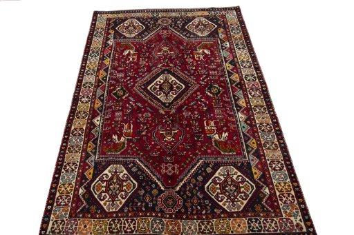 Surface texture of 2000s Shiraz rug with natural Wool and intricate pattern