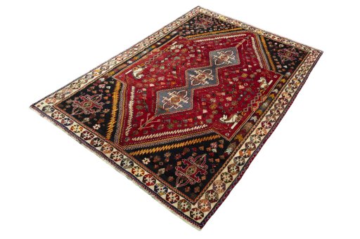 Corner detail of 2000s Shiraz rug showing border pattern and Wool pile