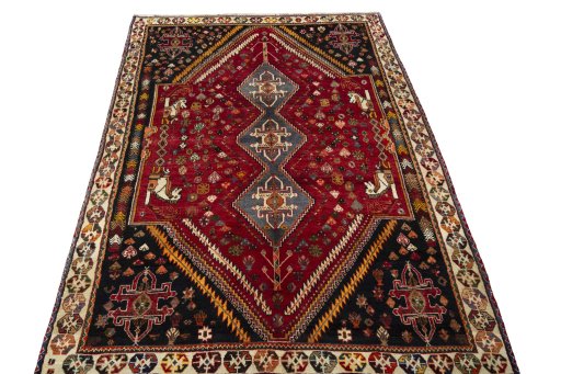 Surface texture of 2000s Shiraz rug with natural Wool and intricate pattern