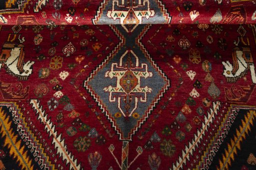 Full view of 2000s Shiraz rug from Iran / Persia, 267 × 185 cm in Red tones