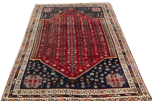 Surface texture of 2000s Shiraz rug with natural Wool and intricate pattern