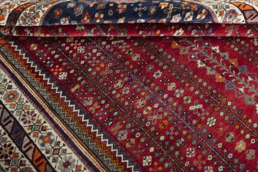Full view of 2000s Shiraz rug from Iran / Persia, 293 × 210 cm in Red tones