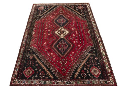 Surface texture of 2000s Shiraz rug with natural Wool and intricate pattern