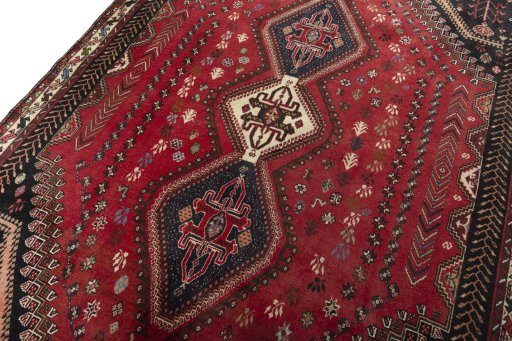 Backside of handmade 2000s Shiraz rug showing knot structure and weave density