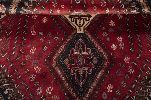 Full view of 2000s Shiraz rug from Iran / Persia, 273 × 181 cm in Red tones