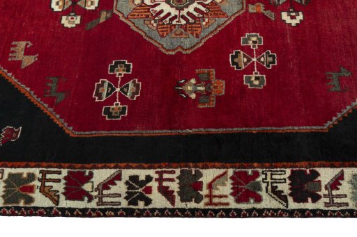Corner detail of 2000s Shiraz rug showing border pattern and Wool pile