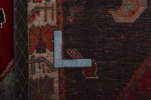 Backside of handmade 2000s Shiraz rug showing knot structure and weave density