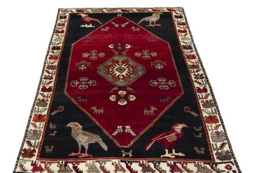 Surface texture of 2000s Shiraz rug with natural Wool and intricate pattern