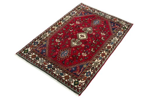 Corner detail of 2000s Shiraz rug showing border pattern and Wool pile