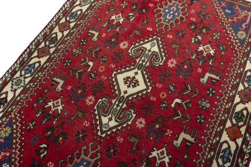 Backside of handmade 2000s Shiraz rug showing knot structure and weave density