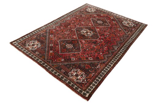Corner detail of 2000s Shiraz rug showing border pattern and Wool pile
