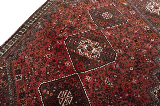 Backside of handmade 2000s Shiraz rug showing knot structure and weave density