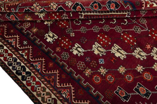 Corner detail of 2000s Shiraz rug showing border pattern and Wool pile
