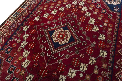 Backside of handmade 2000s Shiraz rug showing knot structure and weave density