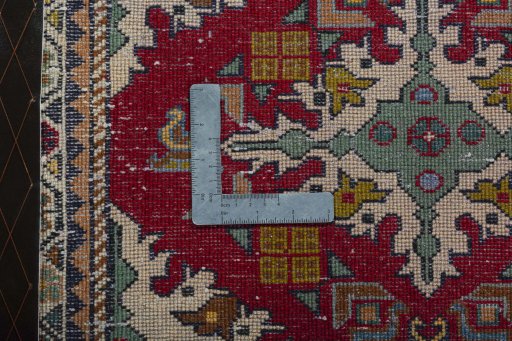 Backside of handmade 2000s Shiraz rug showing knot structure and weave density