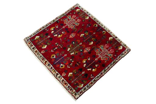 Corner detail of 2000s Shiraz rug showing border pattern and Wool pile