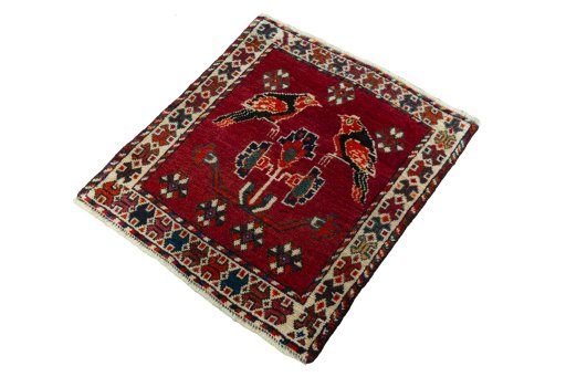 Corner detail of 2000s Shiraz rug showing border pattern and Wool pile