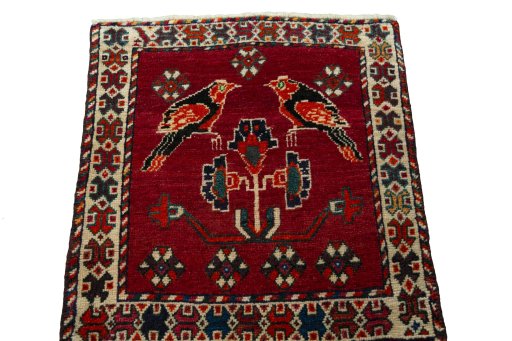 Surface texture of 2000s Shiraz rug with natural Wool and intricate pattern