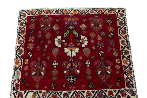Surface texture of 2000s Shiraz rug with natural Wool and intricate pattern