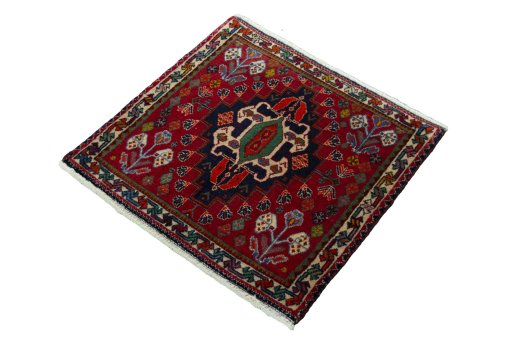 Corner detail of 2000s Shiraz rug showing border pattern and Wool pile