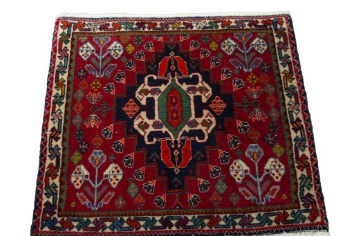 Surface texture of 2000s Shiraz rug with natural Wool and intricate pattern