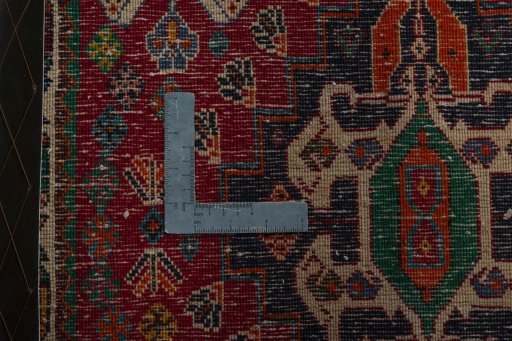 Backside of handmade 2000s Shiraz rug showing knot structure and weave density