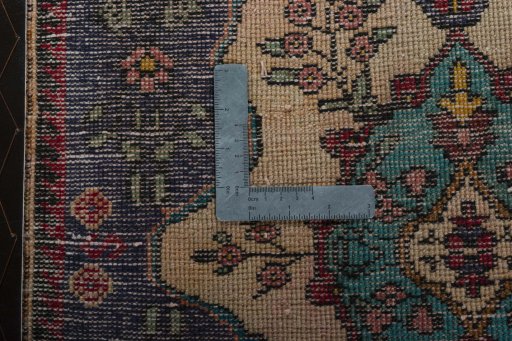 Backside of handmade 2000s Shiraz rug showing knot structure and weave density