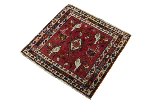 Corner detail of 2000s Shiraz rug showing border pattern and Wool pile