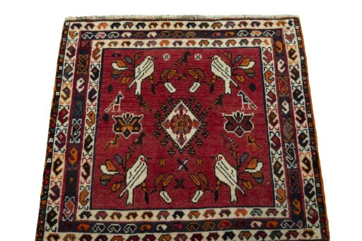 Surface texture of 2000s Shiraz rug with natural Wool and intricate pattern