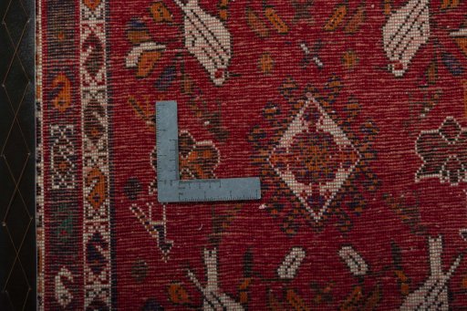 Backside of handmade 2000s Shiraz rug showing knot structure and weave density